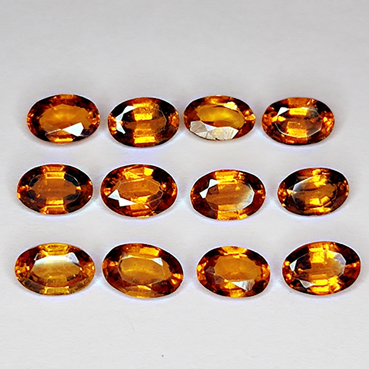 6.73ct Hessonite Granato taglio ovale 6x4mm 12pz