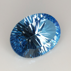 Topacio azul talla oval millenium 18x13mm 1pz