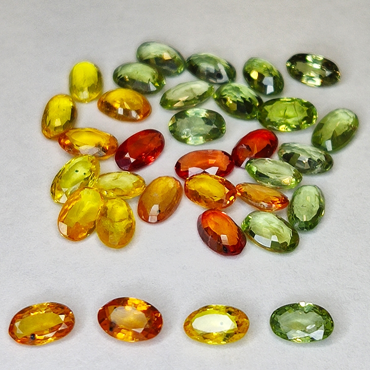 8.94ct Saphir Songea multicolore coupe ovale 5.1x3.0mm 33pcs