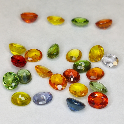 8.87ct Saphir Songea multicolore coupe ovale 4.8x3.7mm 24pcs