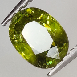 0.71ct Granato Demantoide taglio ovale 6.0x4.6mm