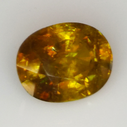 7.43ct Sphène Verte coupe ovale 12.9x10.1mm