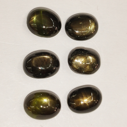 9.73ct Zafiro Estrella Negro cabujón oval 7.6x6.2mm 6pz