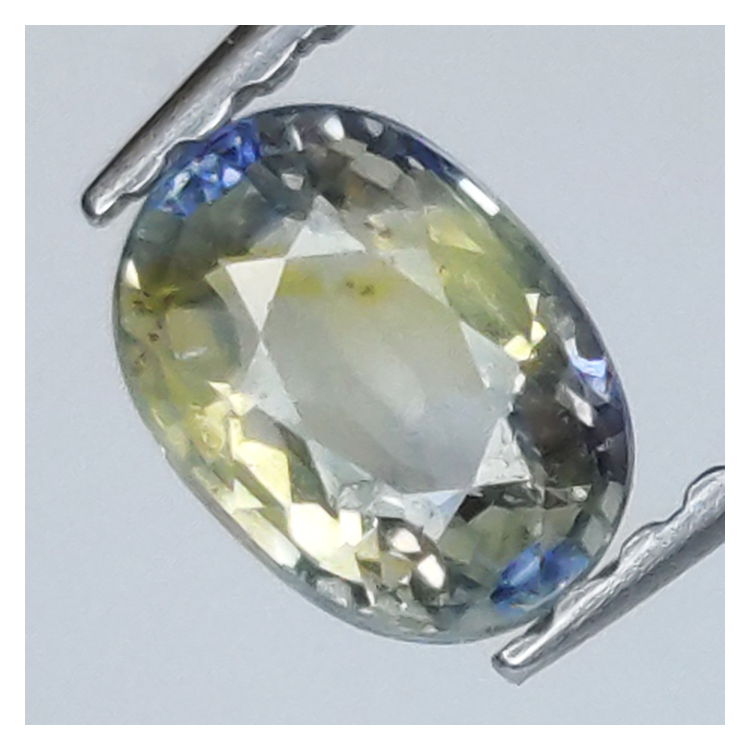 0,84 ct blauer und gelber Saphir im Ovalschliff, 5,82 x 4,28 mm