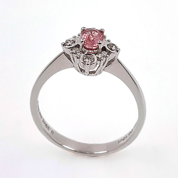 18KT white gold ring with Padparadscha Sapphire and diamond.