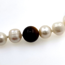 Silver necklace of river pearls and tiger eye 11 mm with a length of 40 cm.