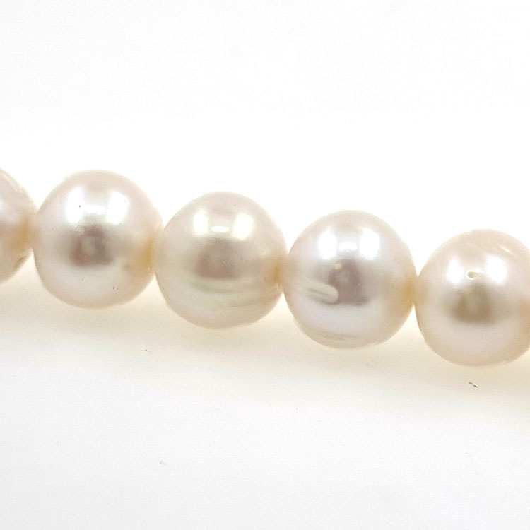 Strand of river pearls of 12 mmwith 40 cm long