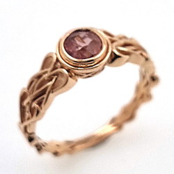 Unheated Padsparadcha Sapphire Ring in 18 kt rose gold Celtic knot