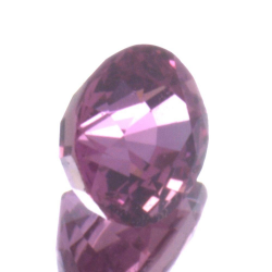 Saphir Padparadscha 0,79 ct taille ovale 5,59x4,72 mm